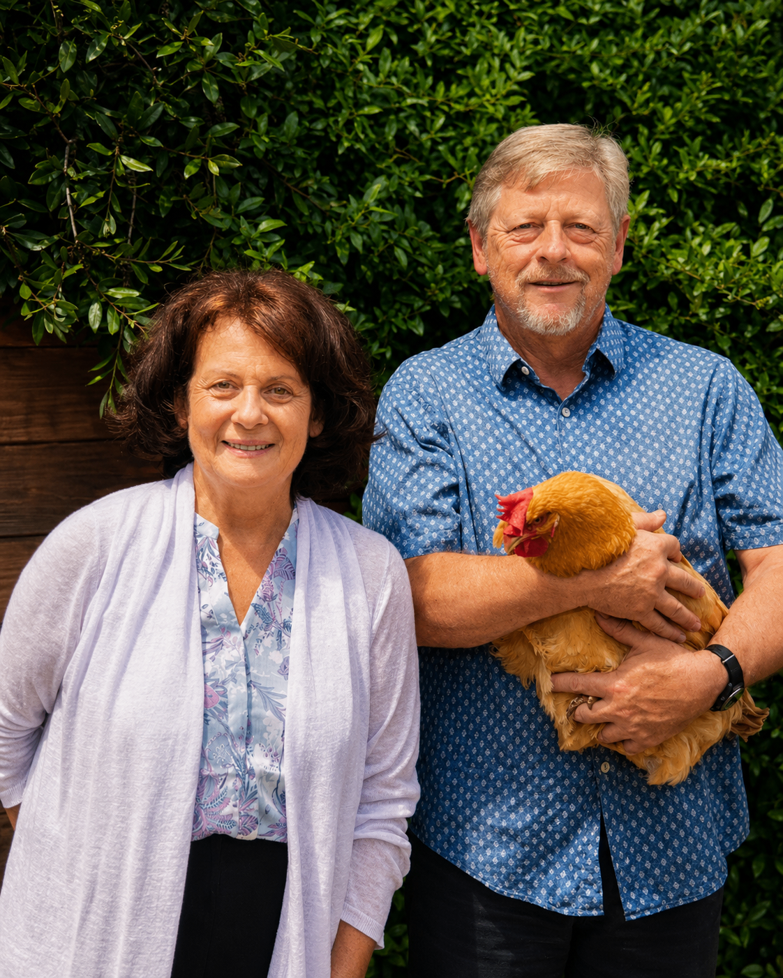 Ernest Koeppen and his wife Denise in La Cañada Flintridge, Ernest holding a chicken